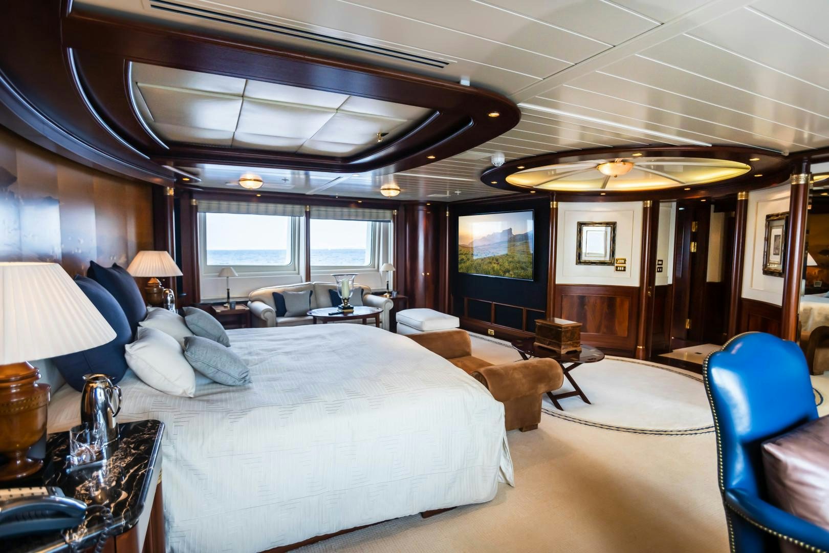 a large bedroom with a large bed aboard FARIBANA V Yacht for Sale