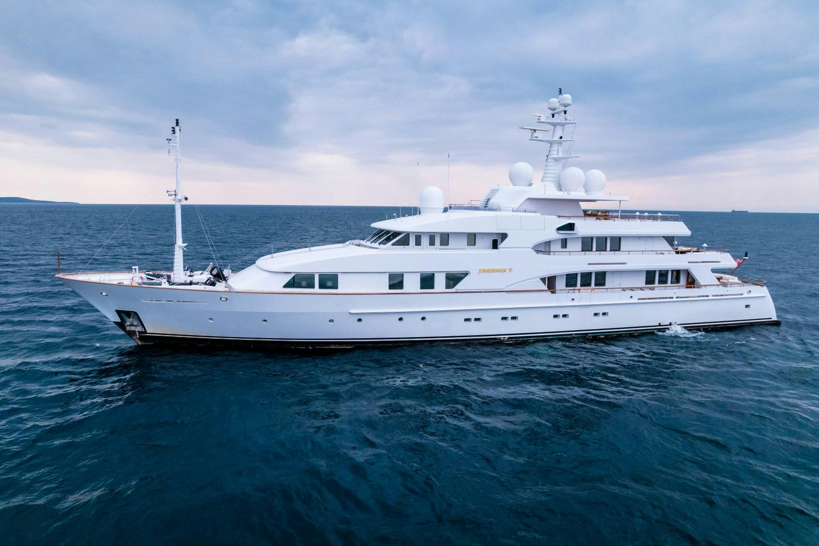 a white yacht in the water aboard FARIBANA V Yacht for Sale