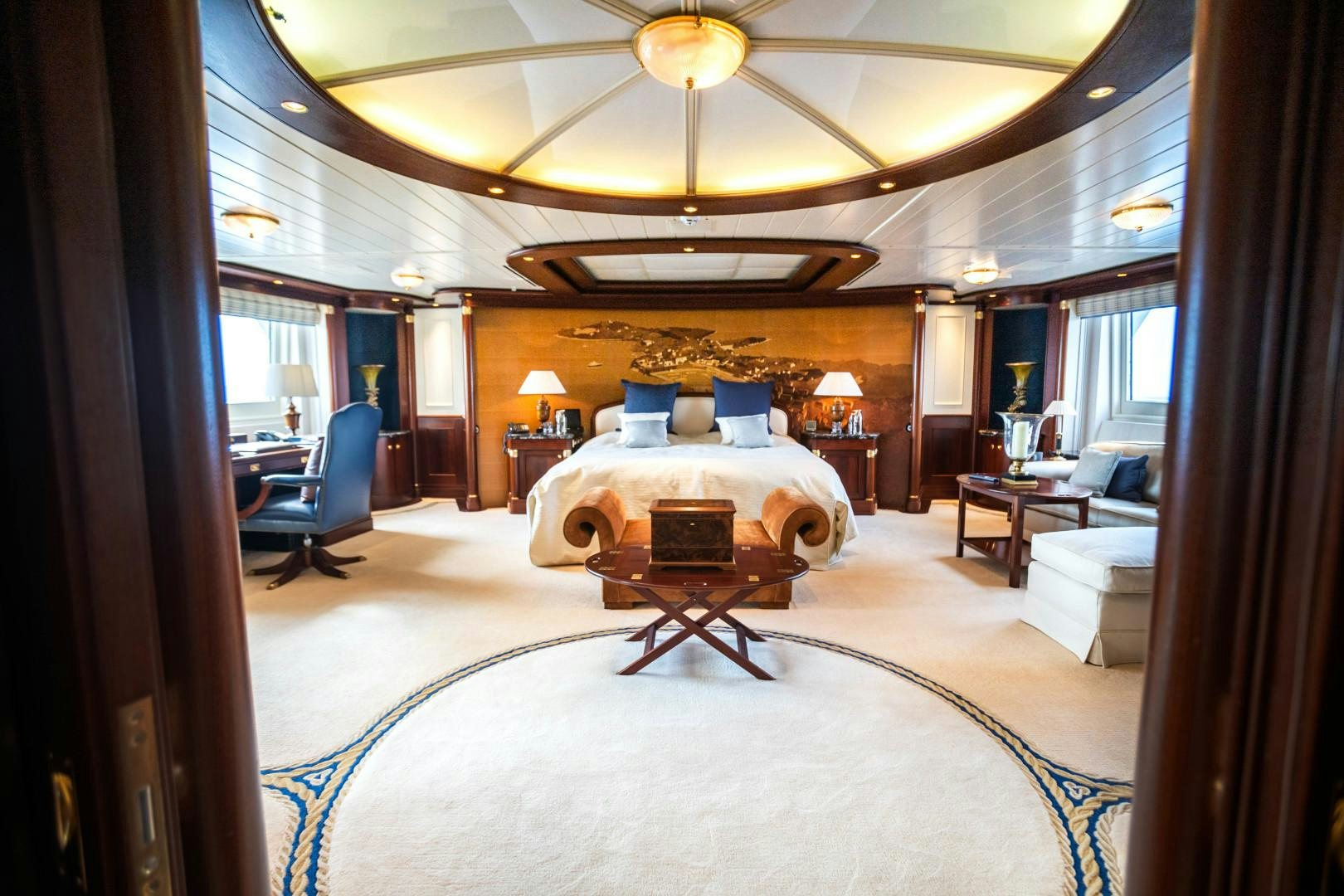a large bed in a room aboard FARIBANA V Yacht for Sale