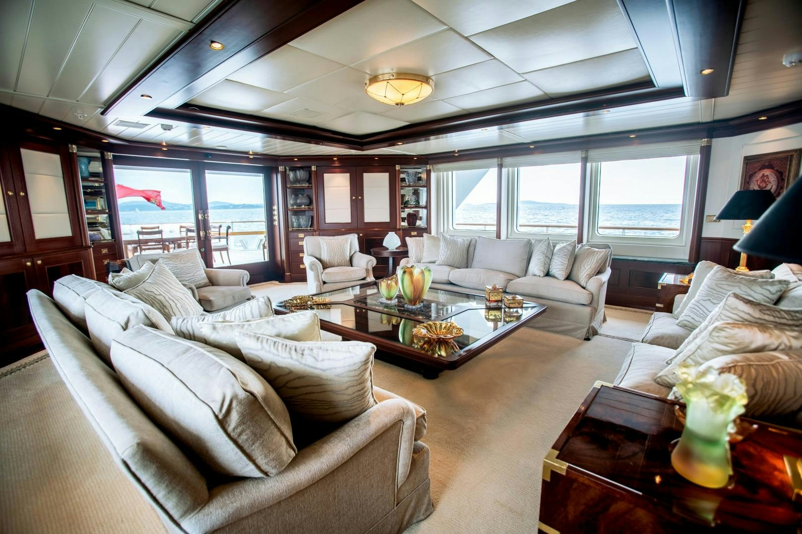 a living room with a large window aboard FARIBANA V Yacht for Sale