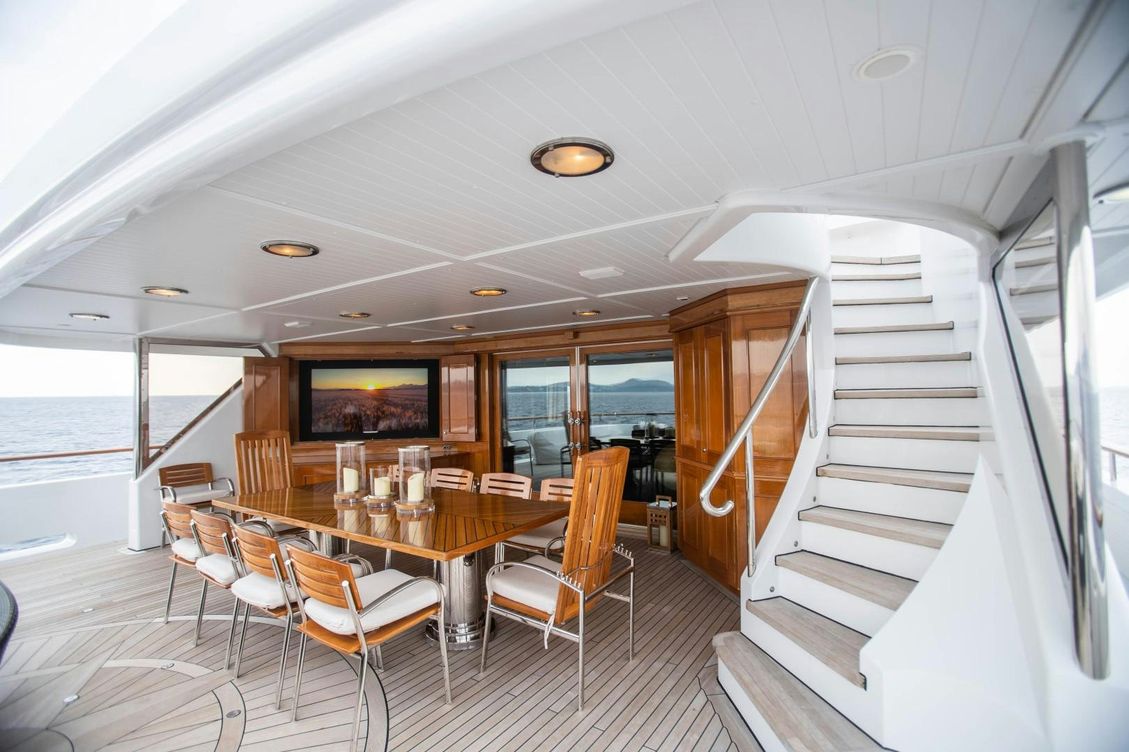 a room with a table and chairs aboard FARIBANA V Yacht for Sale
