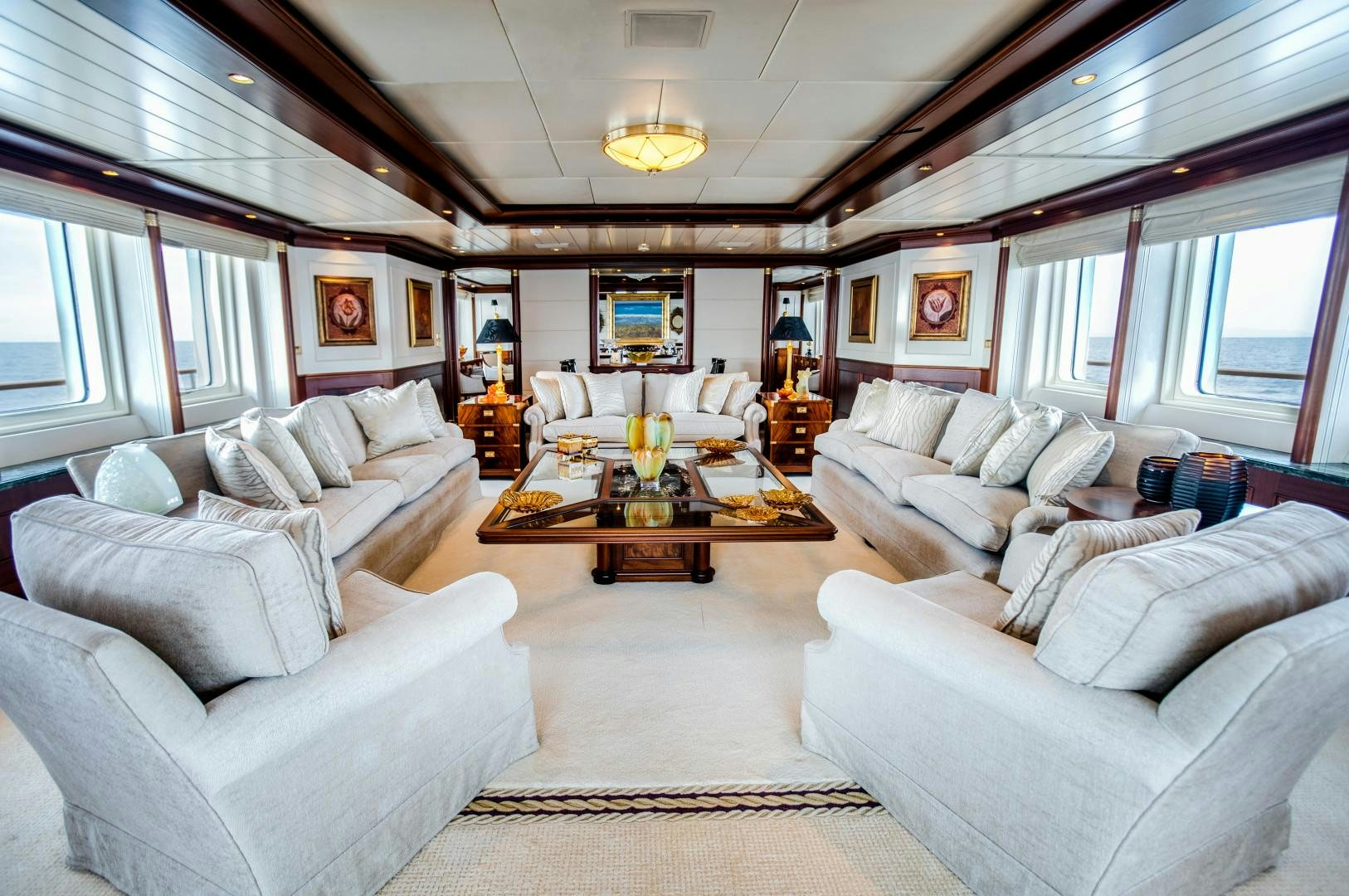 a living room with a large window aboard FARIBANA V Yacht for Sale