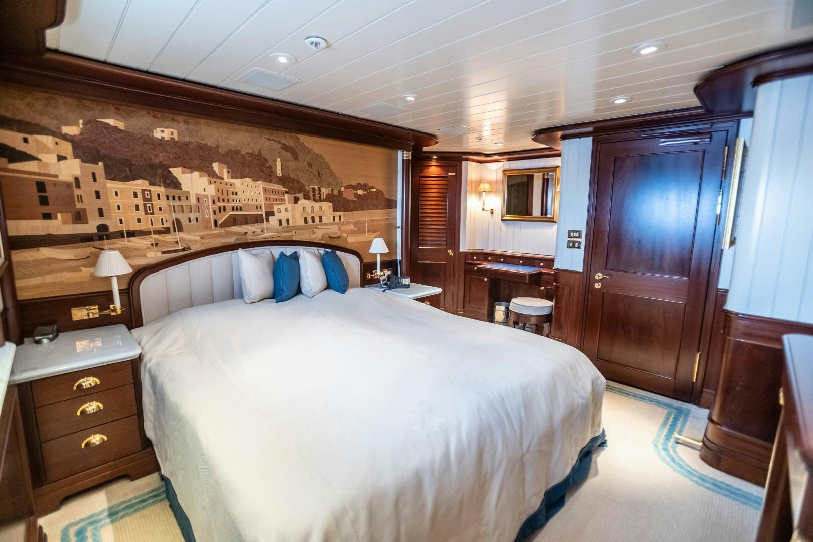 a large bedroom with a large bed aboard FARIBANA V Yacht for Sale