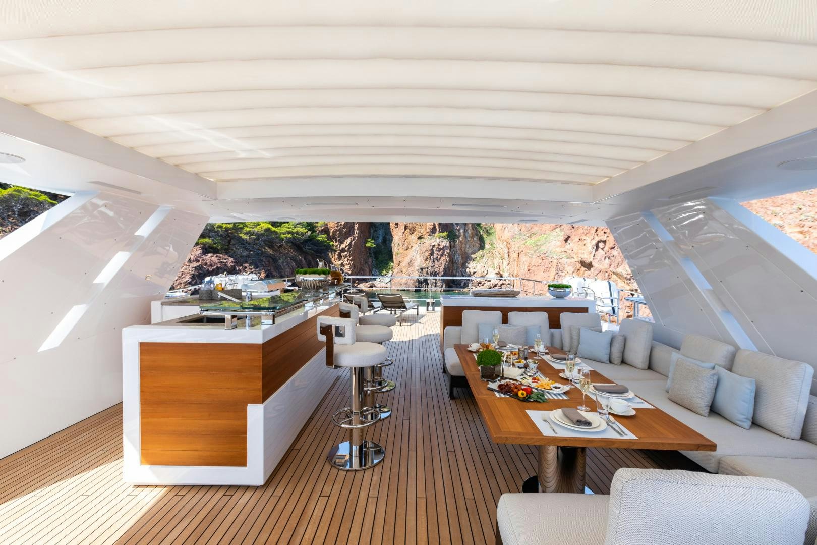 a room with a table and chairs aboard JACOZAMI Yacht for Sale