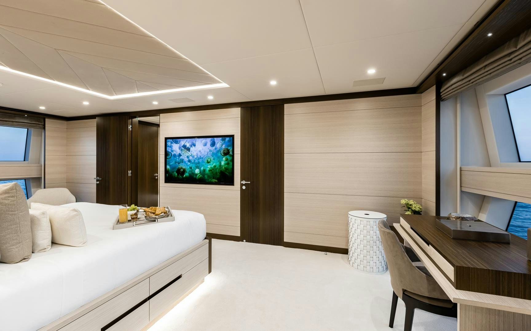 a room with a bed and a desk aboard JACOZAMI Yacht for Sale