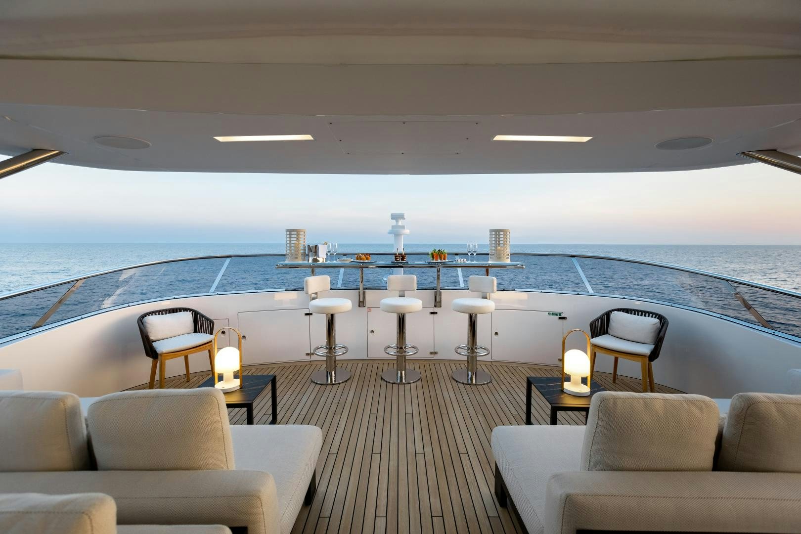 a large cruise ship with chairs and tables and a large window aboard JACOZAMI Yacht for Sale