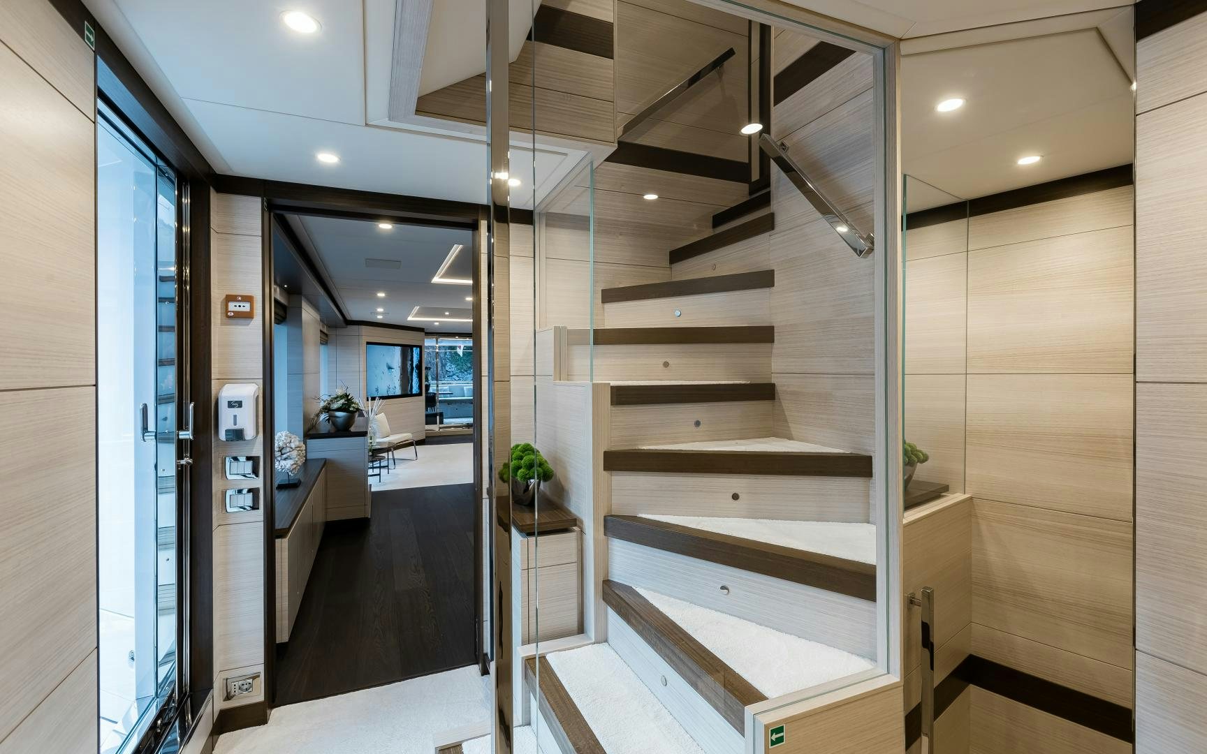 a hallway with a set of stairs aboard JACOZAMI Yacht for Sale