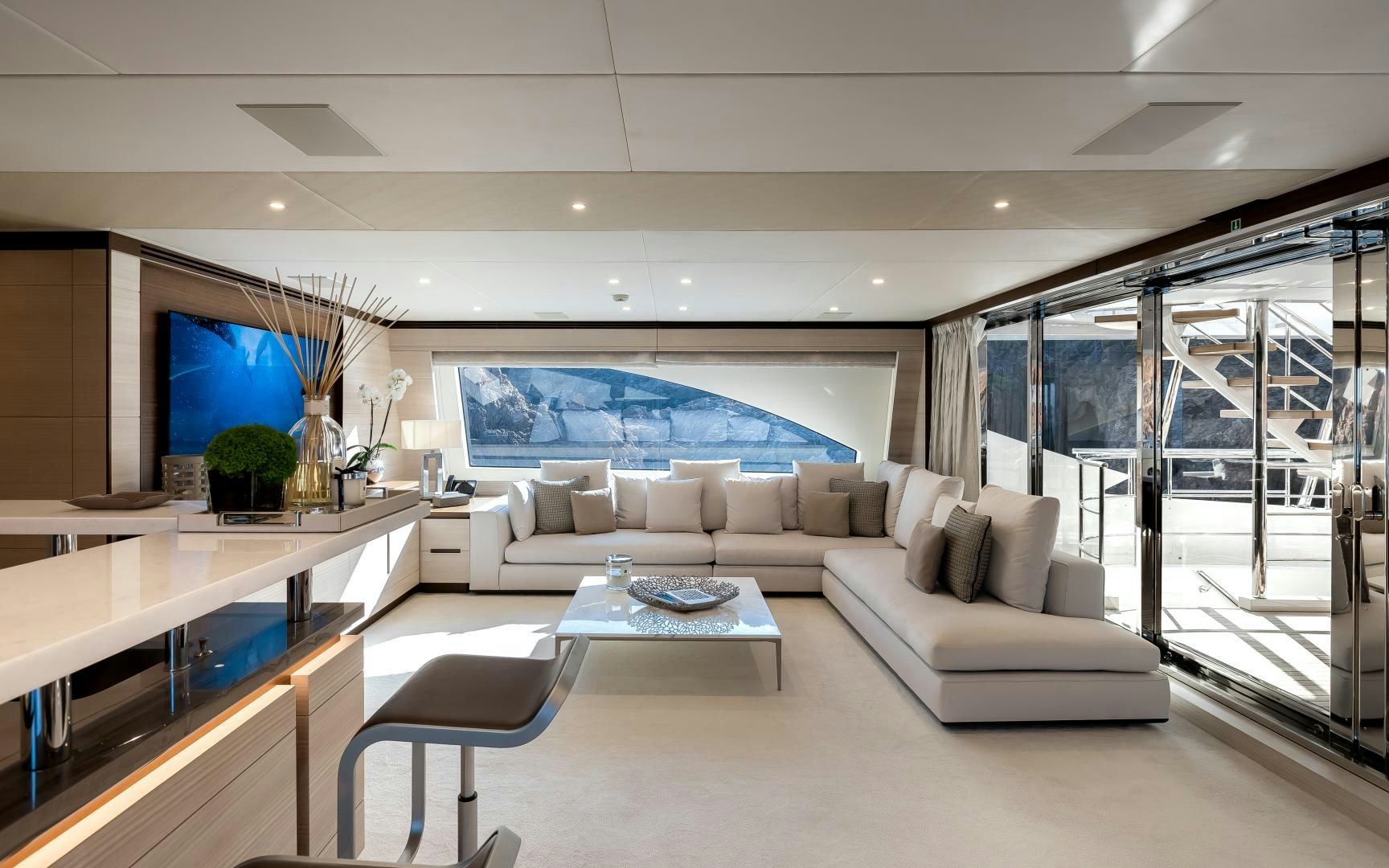 a living room with a large window aboard JACOZAMI Yacht for Sale