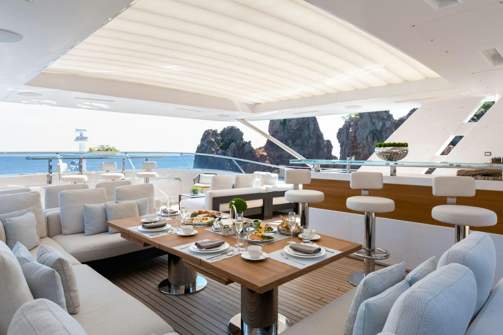 a large table with chairs around it aboard JACOZAMI Yacht for Sale