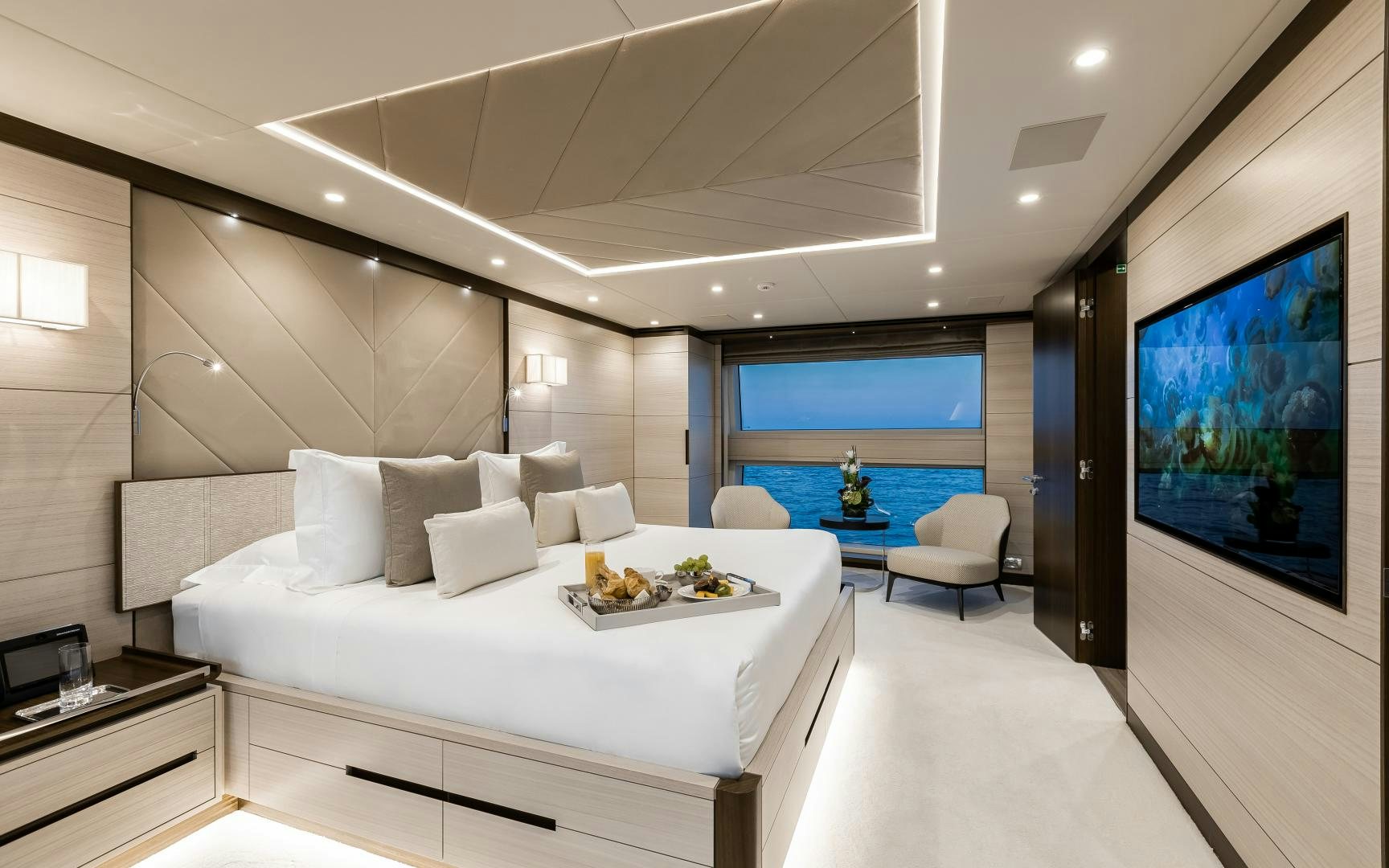 a room with a bed and a table aboard JACOZAMI Yacht for Sale