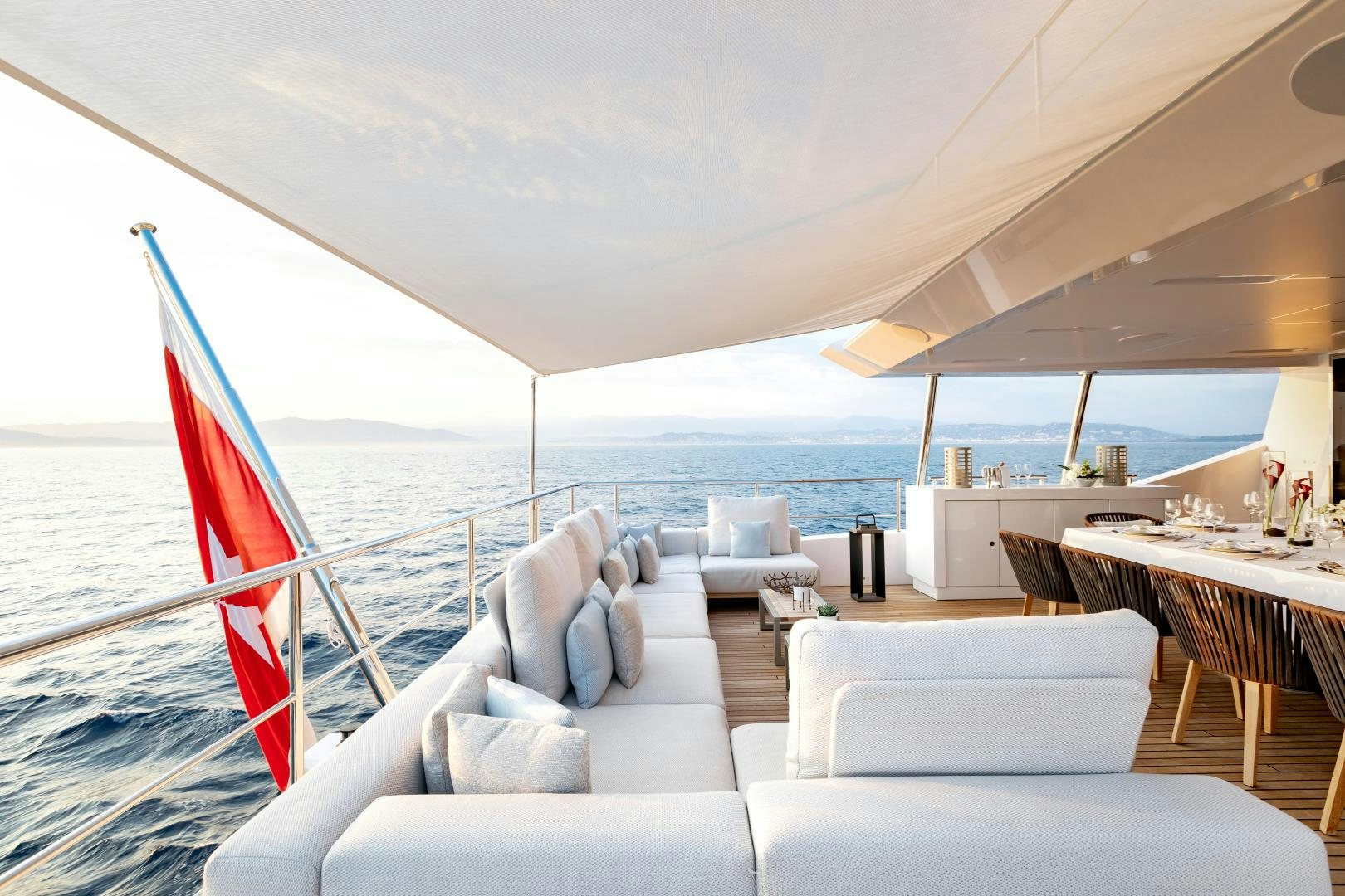 a boat with a beach view aboard JACOZAMI Yacht for Sale