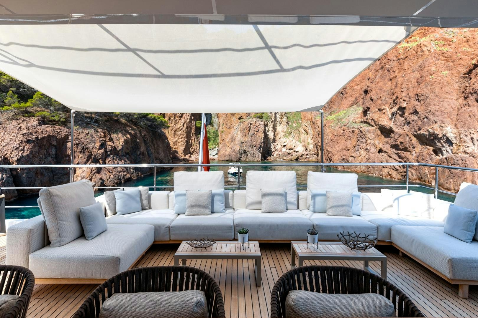 a patio with a table and chairs aboard JACOZAMI Yacht for Sale