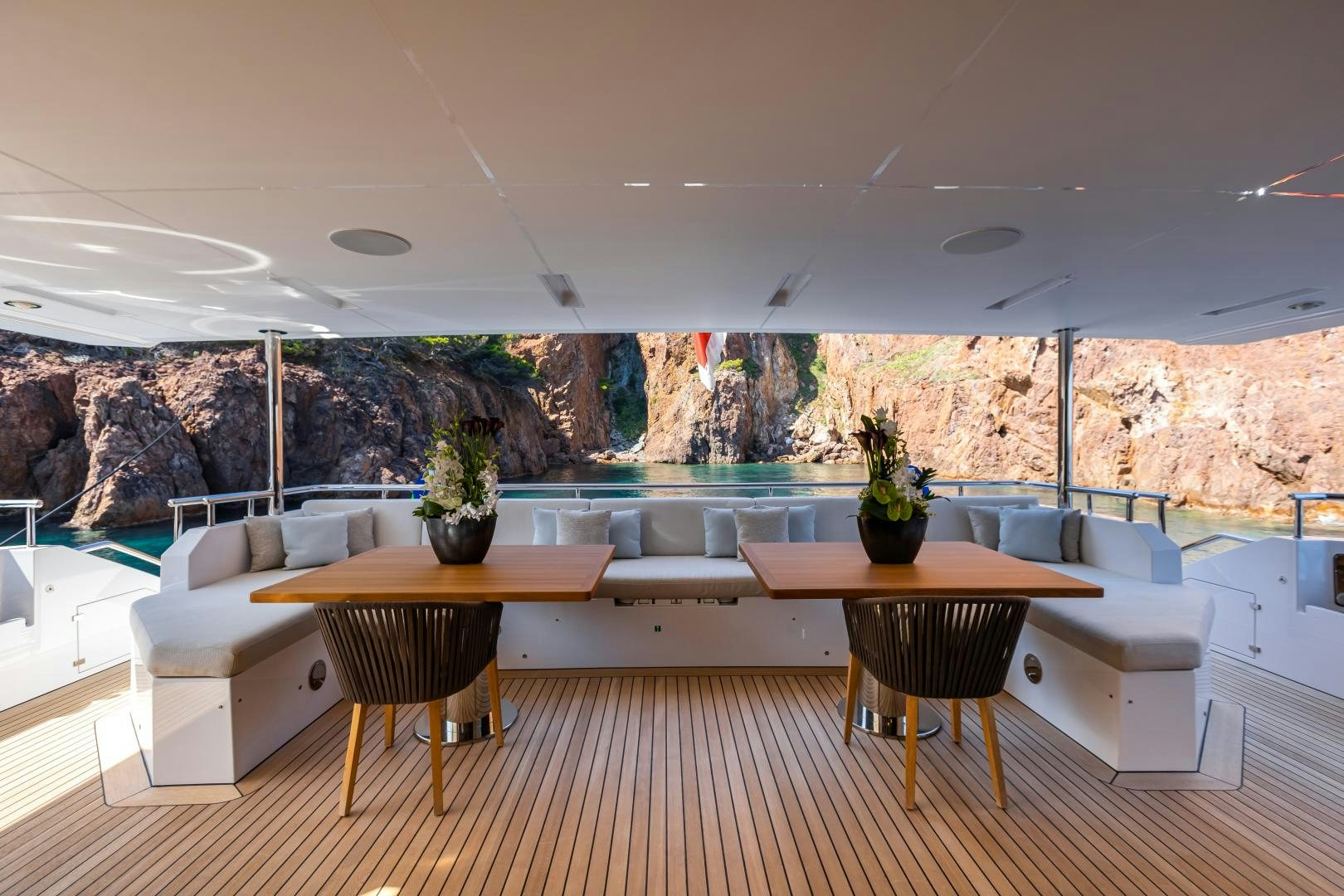 a room with a table and couches aboard JACOZAMI Yacht for Sale