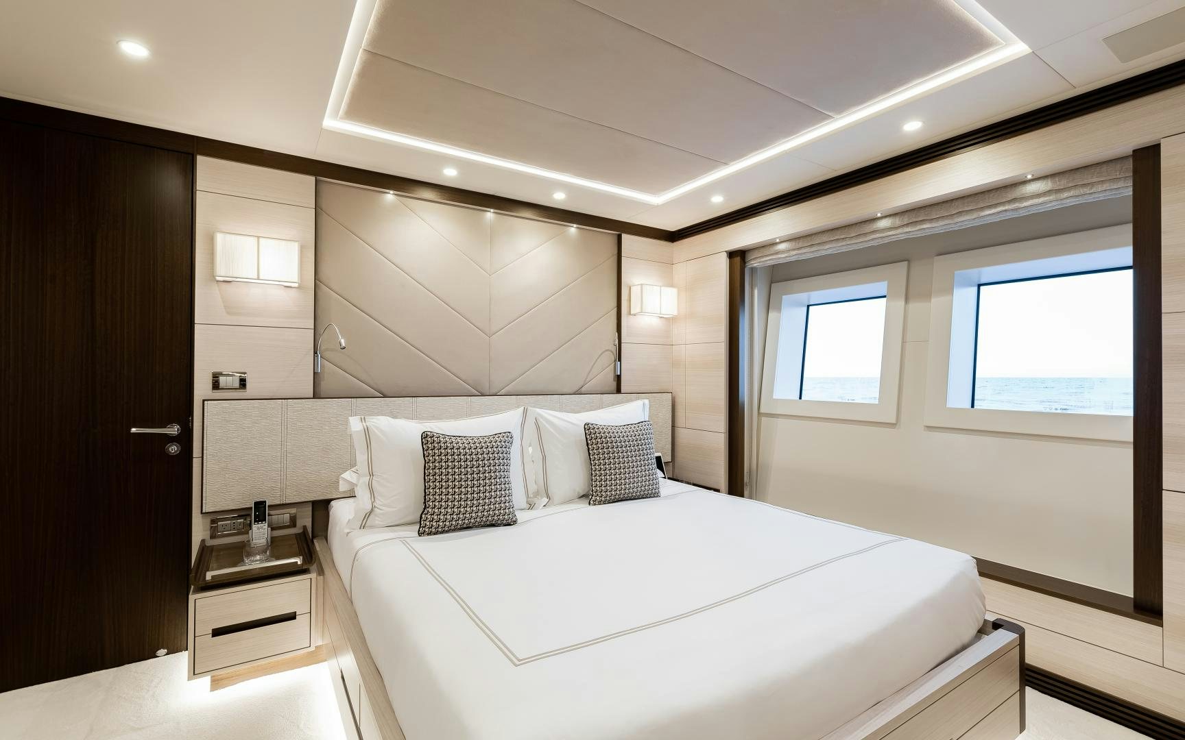 a bedroom with a bed aboard JACOZAMI Yacht for Sale