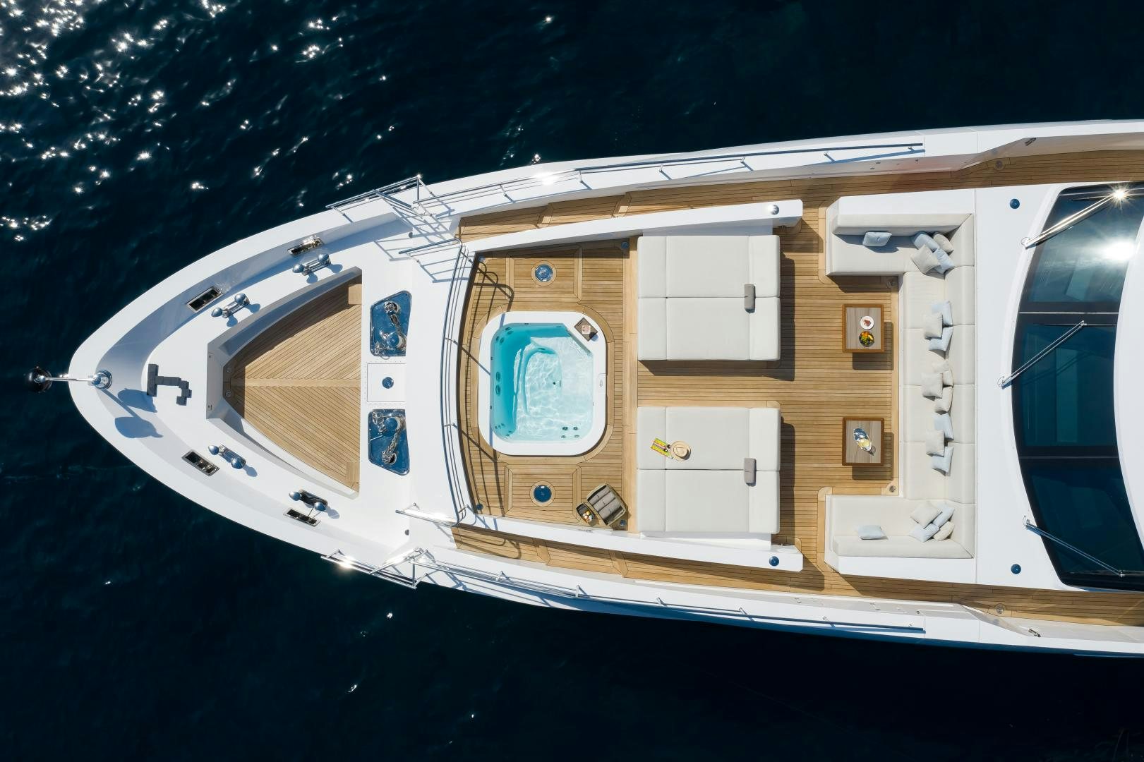 a white vehicle with a blue door aboard JACOZAMI Yacht for Sale