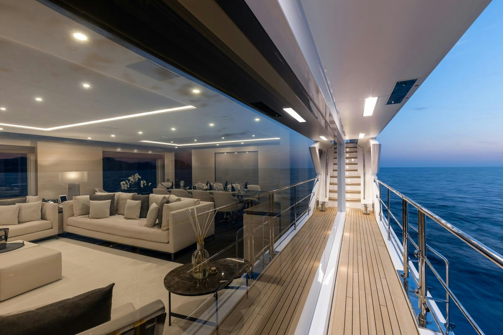 a large deck with a couch and a large pool aboard JACOZAMI Yacht for Sale