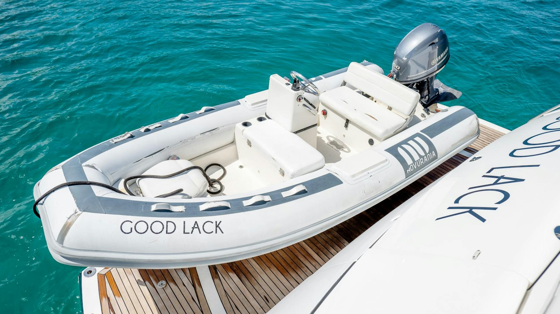 a white yacht on the water aboard GOOD LACK Yacht for Sale