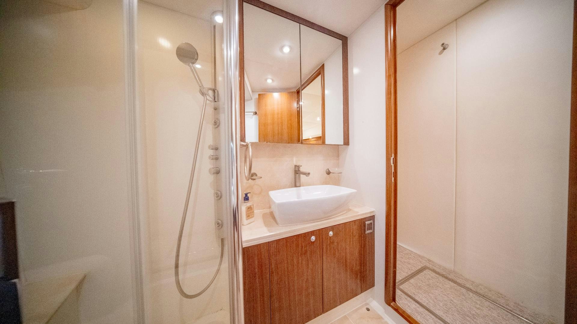 a bathroom with a sink and a mirror aboard GOOD LACK Yacht for Sale