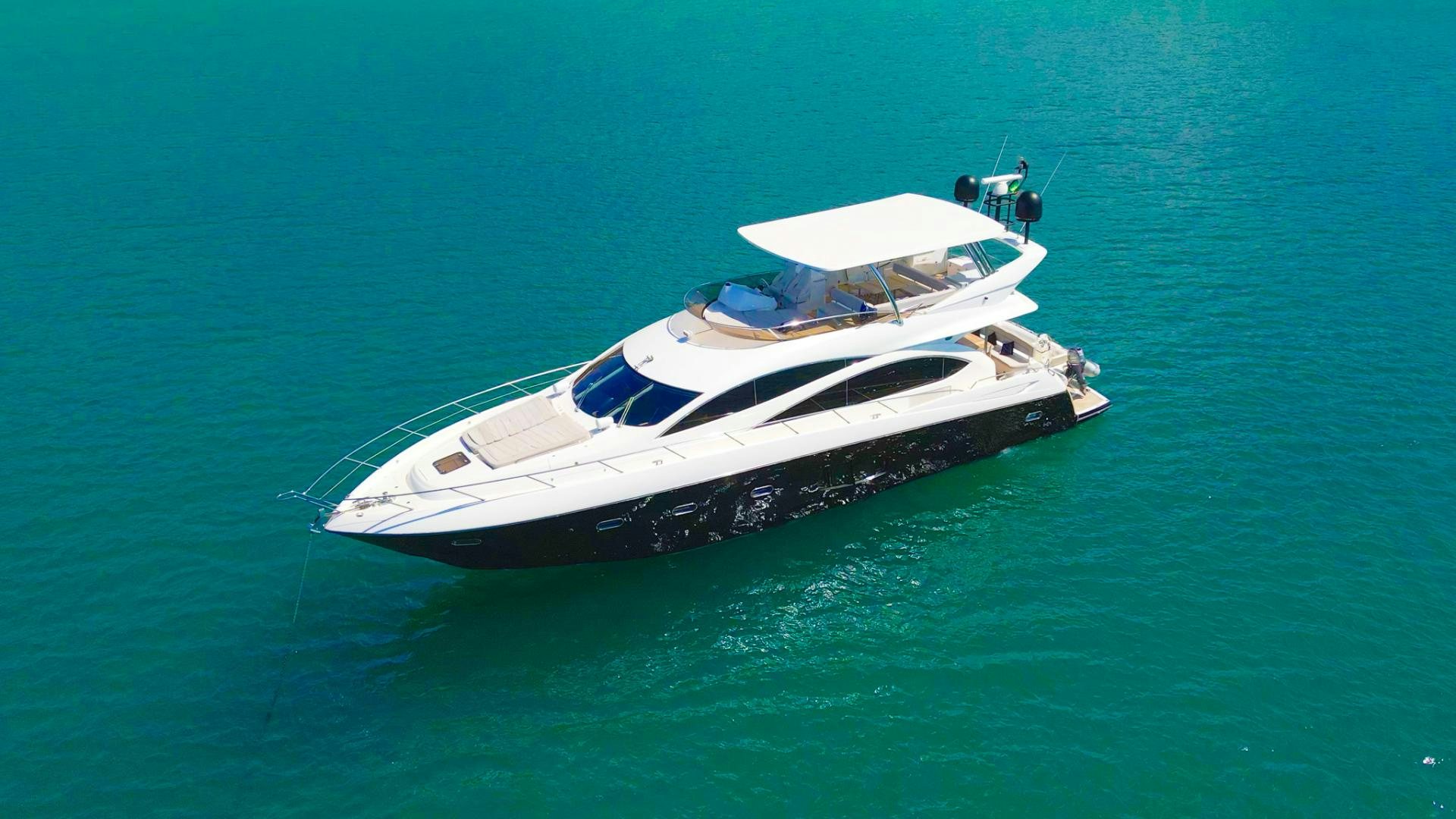 a white yacht in the water aboard GOOD LACK Yacht for Sale