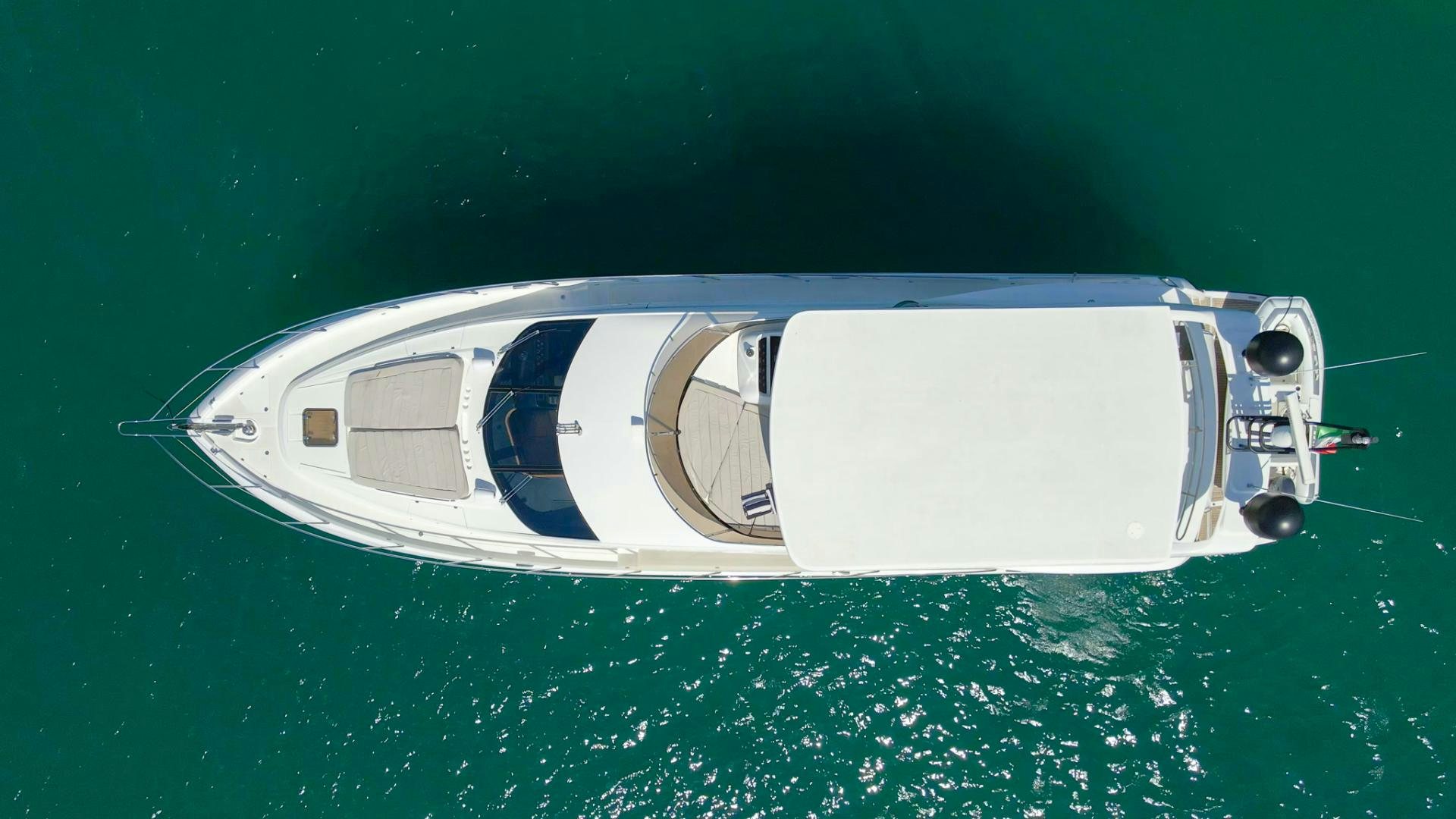 a white boat in the water aboard GOOD LACK Yacht for Sale