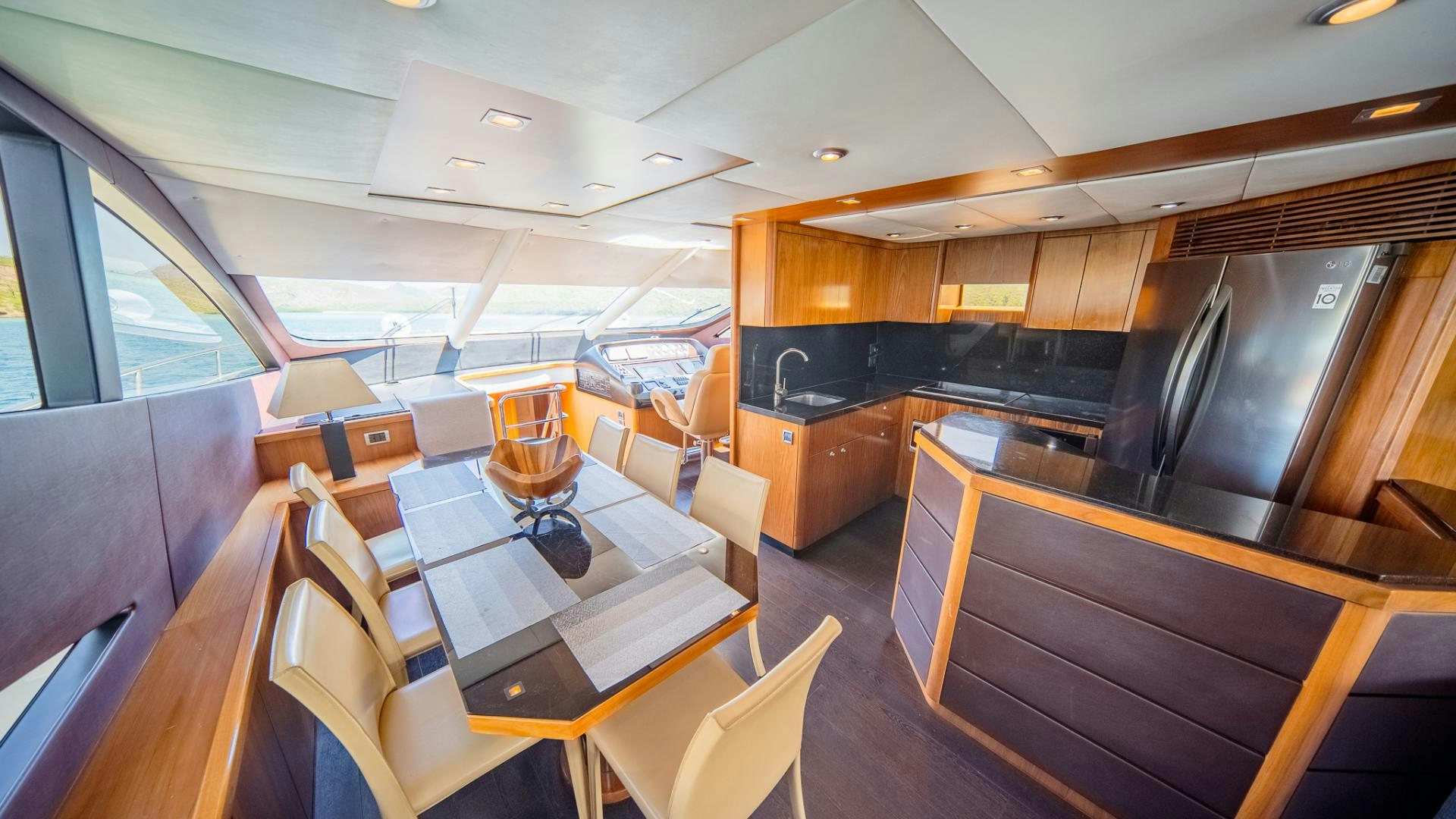 a kitchen with a table and chairs aboard GOOD LACK Yacht for Sale