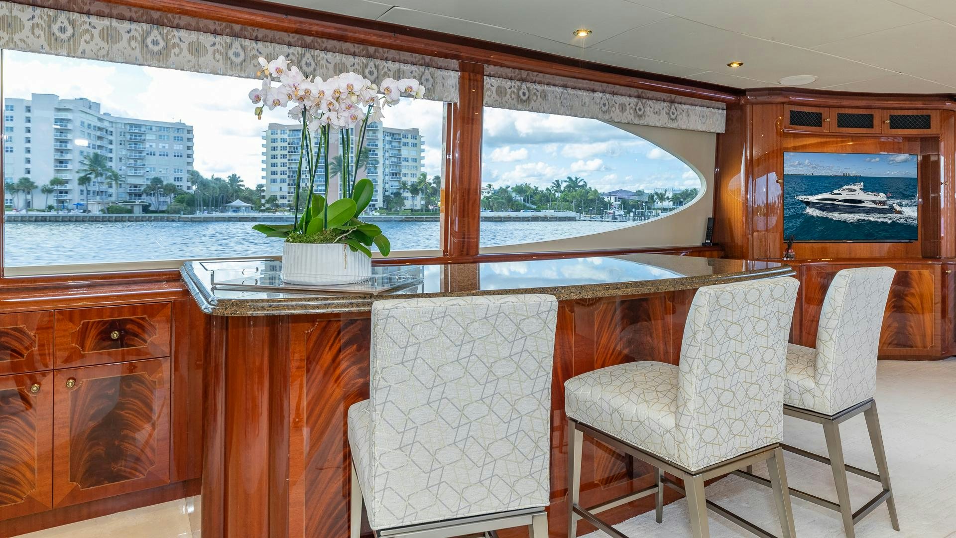 a room with a table chairs and a plant in it aboard HOPE FLOATS Yacht for Sale