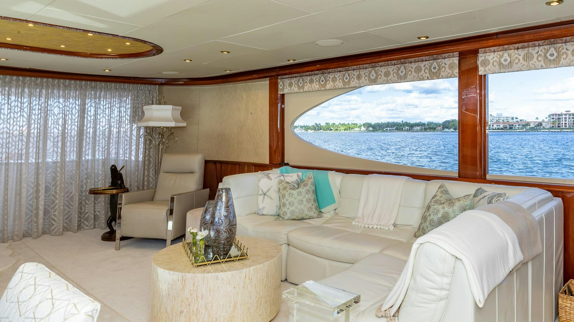 a room with a couch and a table and a window aboard HOPE FLOATS Yacht for Sale