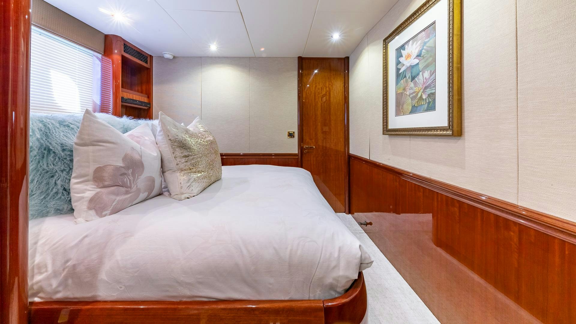 a bed with pillows aboard HOPE FLOATS Yacht for Sale