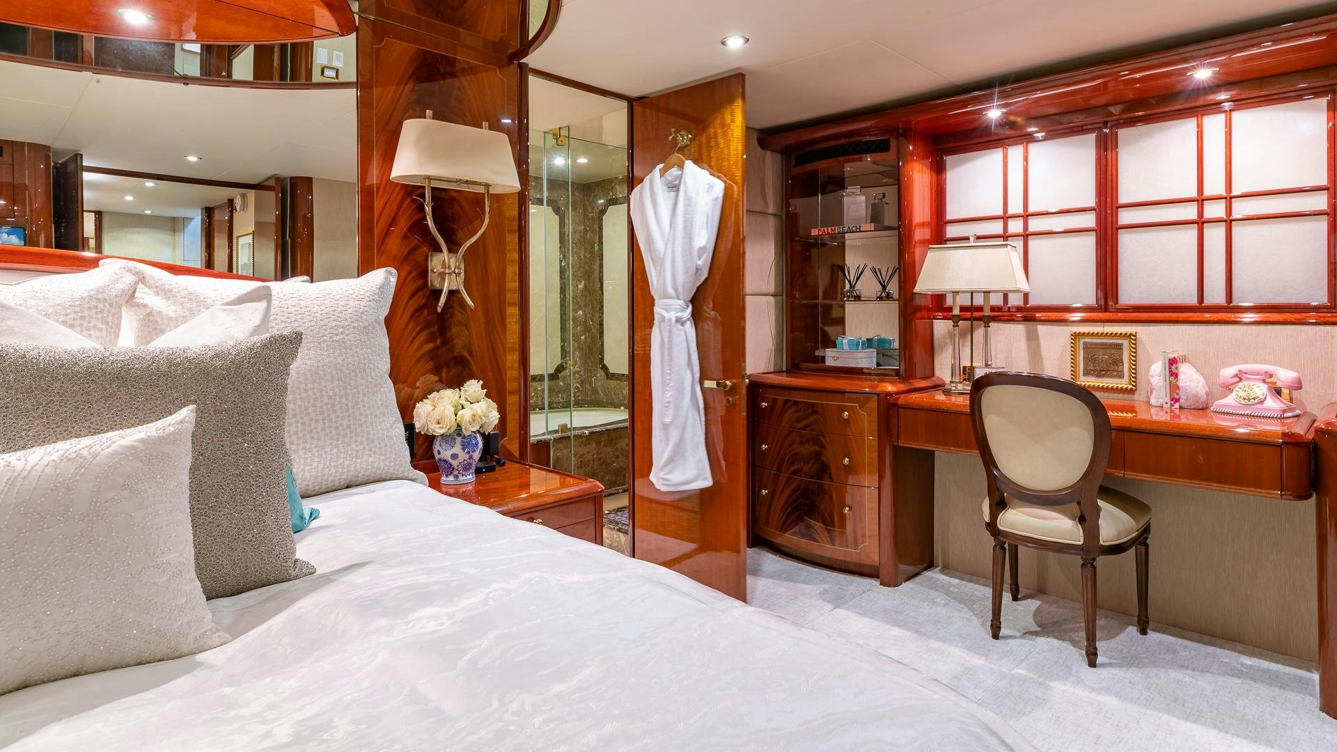 a bedroom with a bed and desk aboard HOPE FLOATS Yacht for Sale