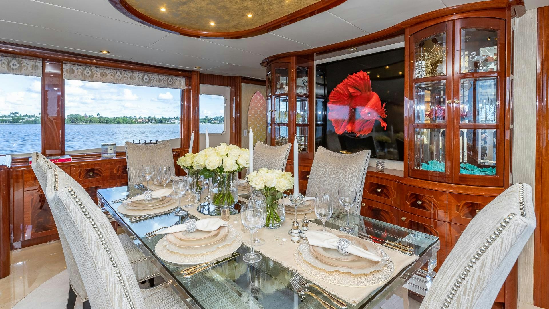 a dining room with a table set aboard HOPE FLOATS Yacht for Sale