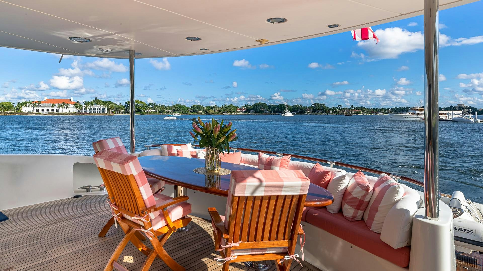 a table and chairs on a boat aboard HOPE FLOATS Yacht for Sale