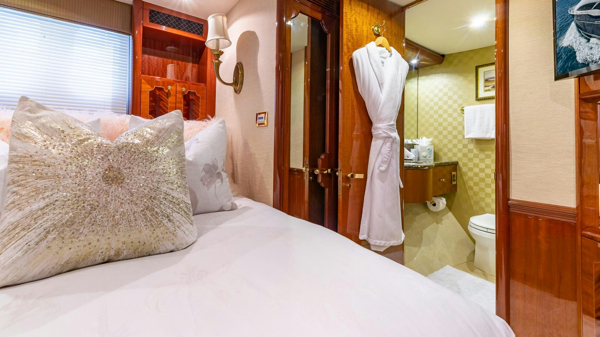 a bed with white sheets aboard HOPE FLOATS Yacht for Sale