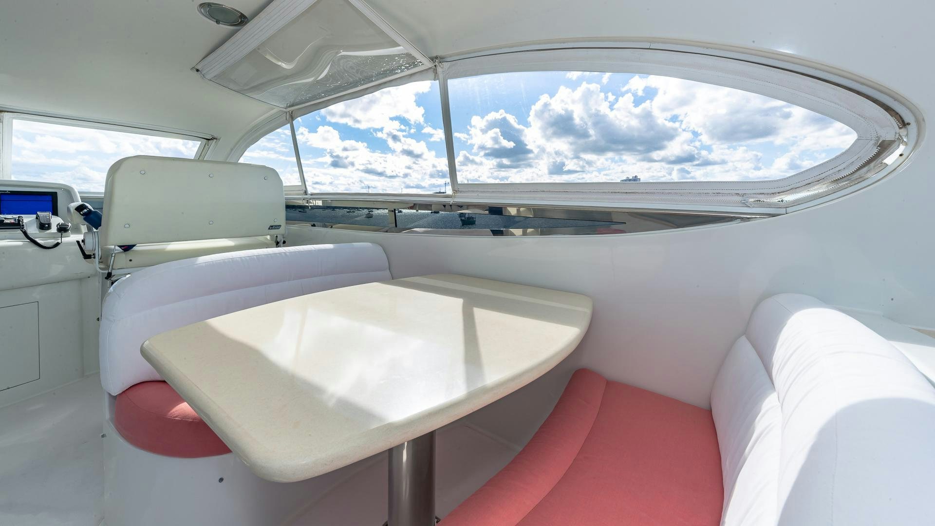 a white car with a table and chairs in the back aboard HOPE FLOATS Yacht for Sale