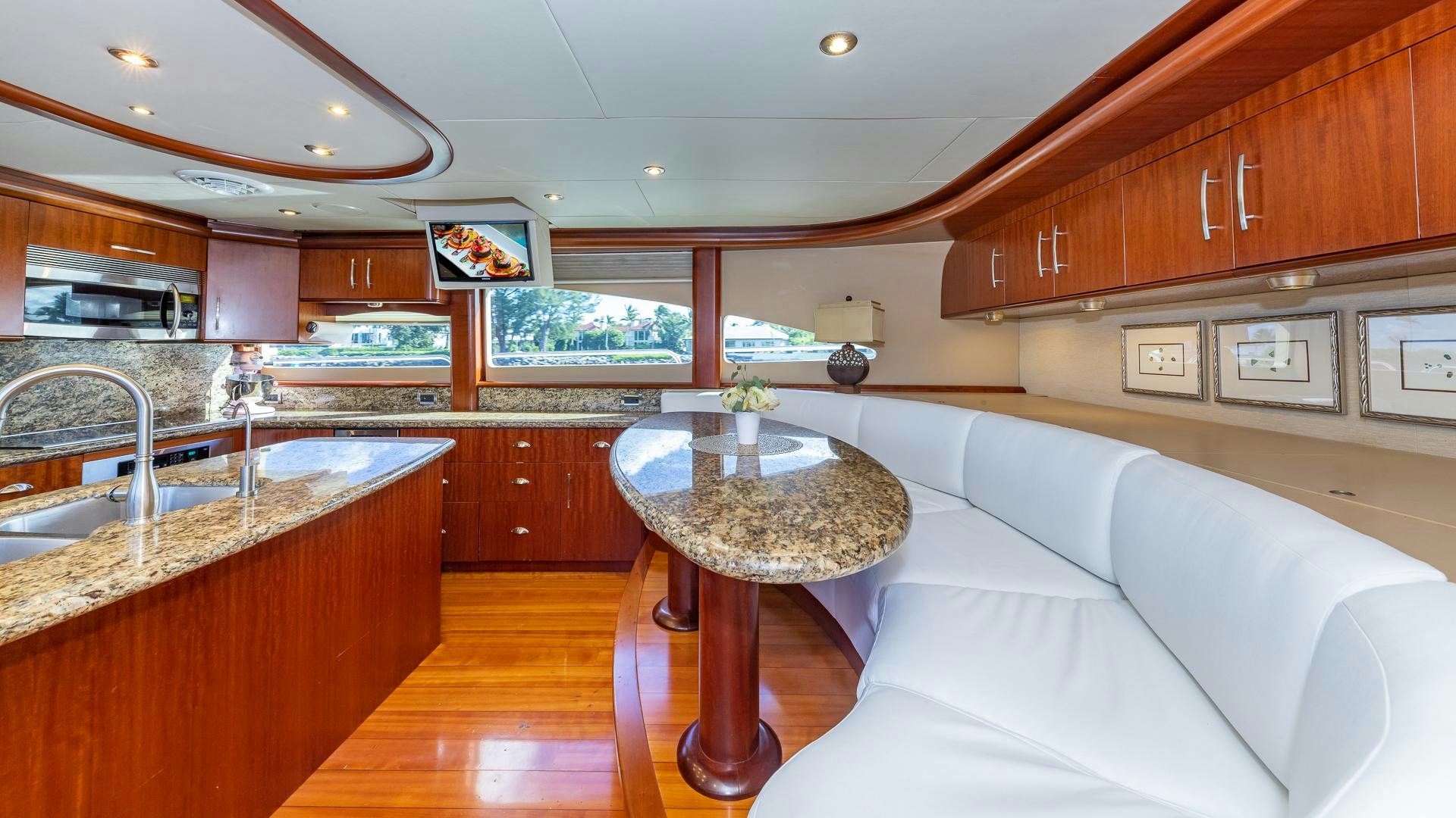 a large kitchen with a table aboard HOPE FLOATS Yacht for Sale