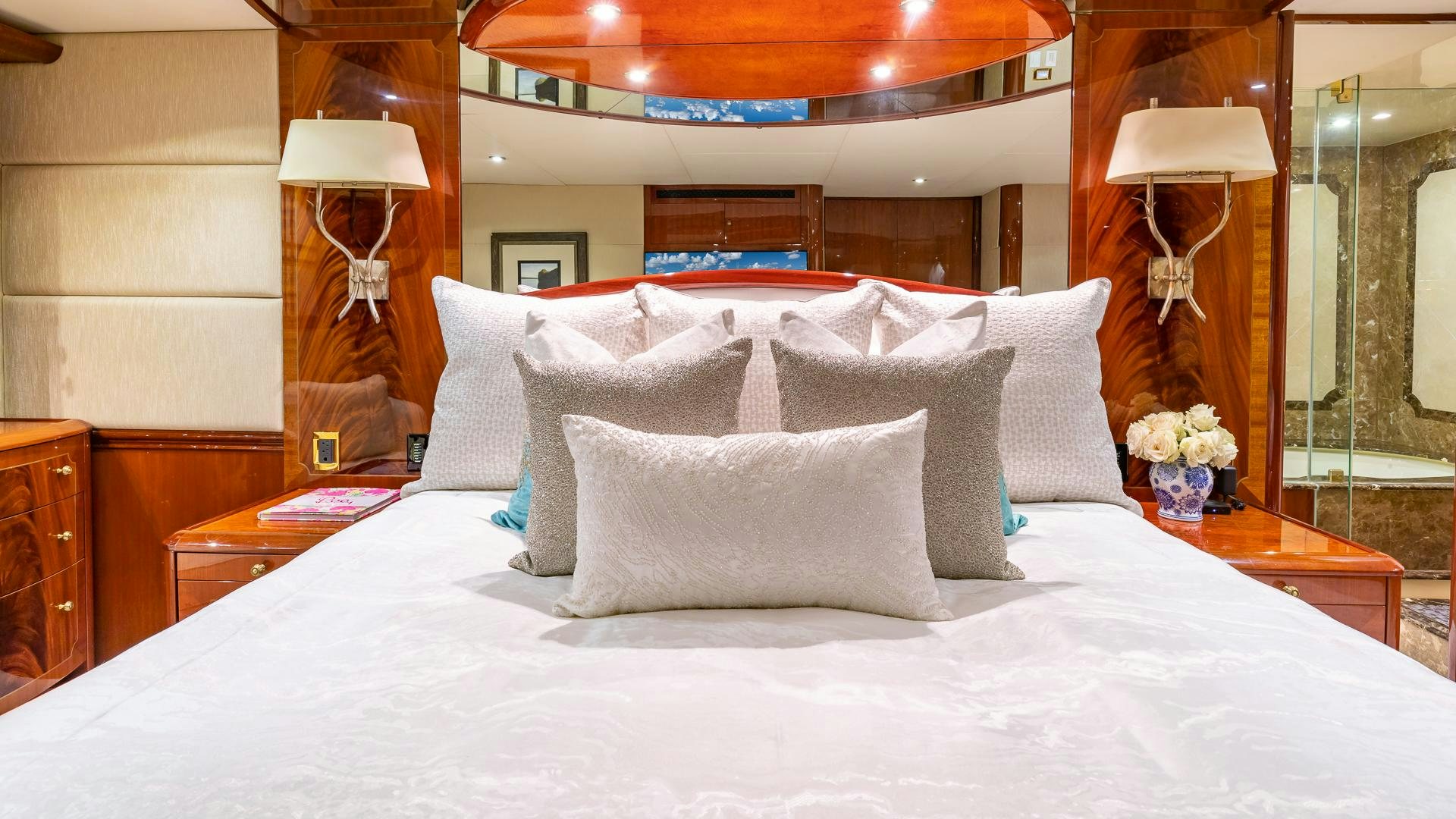 a bed with white sheets and pillows aboard HOPE FLOATS Yacht for Sale