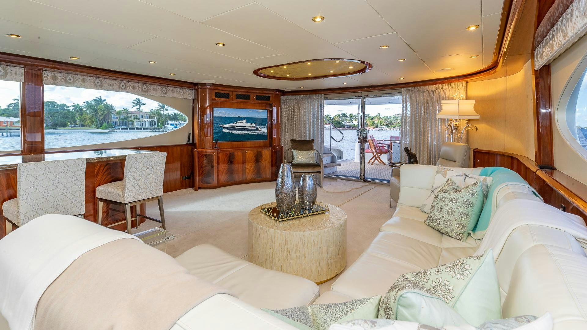a living room with a large window aboard HOPE FLOATS Yacht for Sale