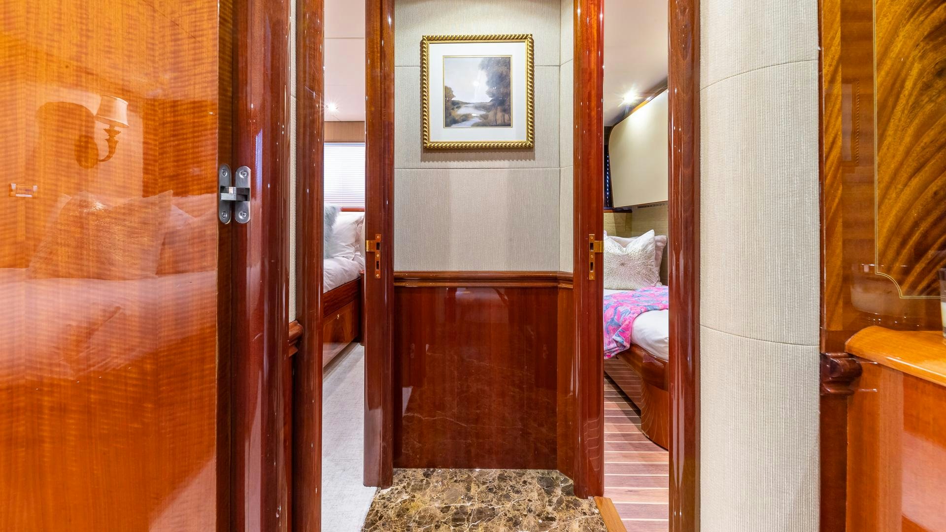 a room with a bed and a mirror aboard HOPE FLOATS Yacht for Sale