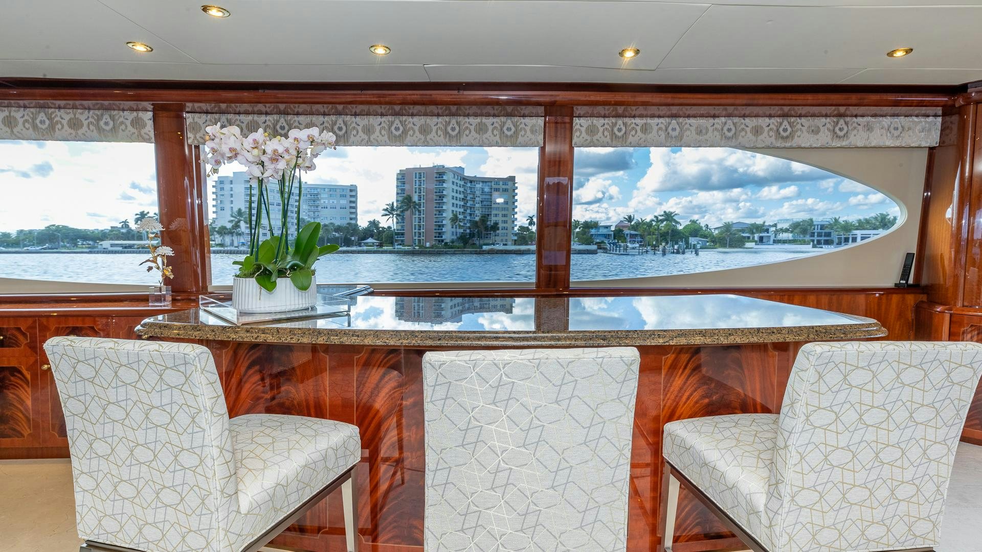 a room with a view of a city and a large window aboard HOPE FLOATS Yacht for Sale