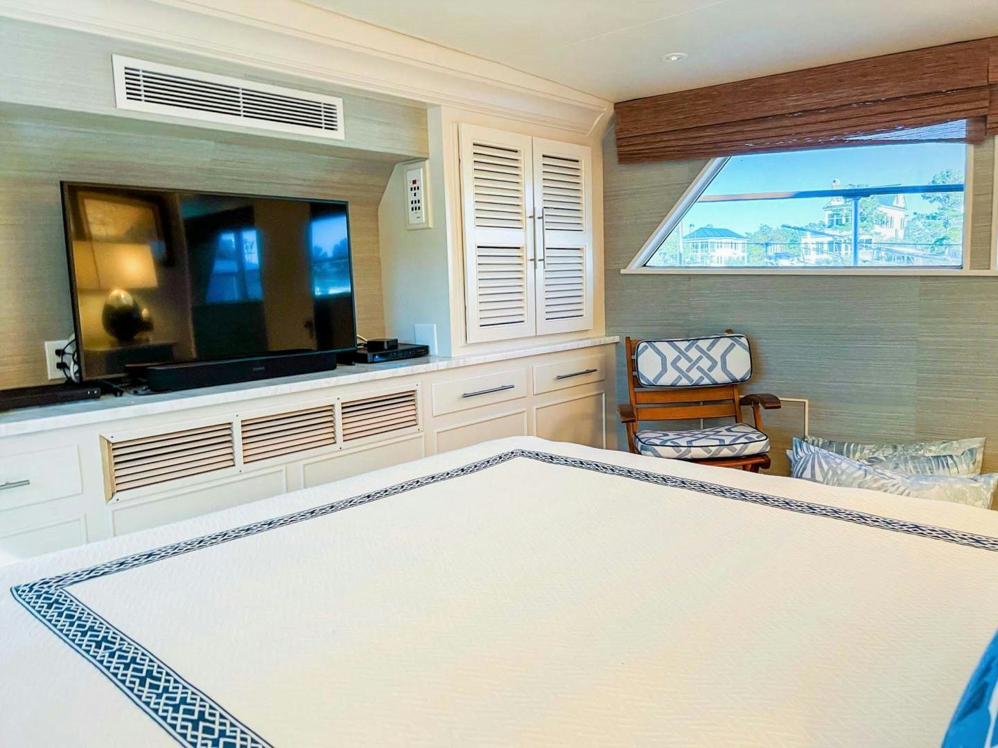 a large white table in a room aboard FREEDOM Yacht for Sale