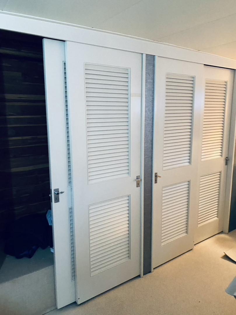 a room with doors aboard FREEDOM Yacht for Sale