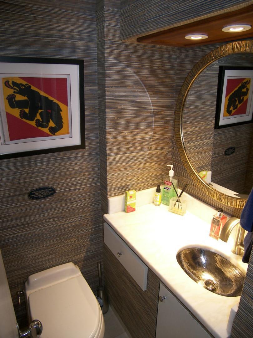 a bathroom with a sink and a mirror aboard FREEDOM Yacht for Sale