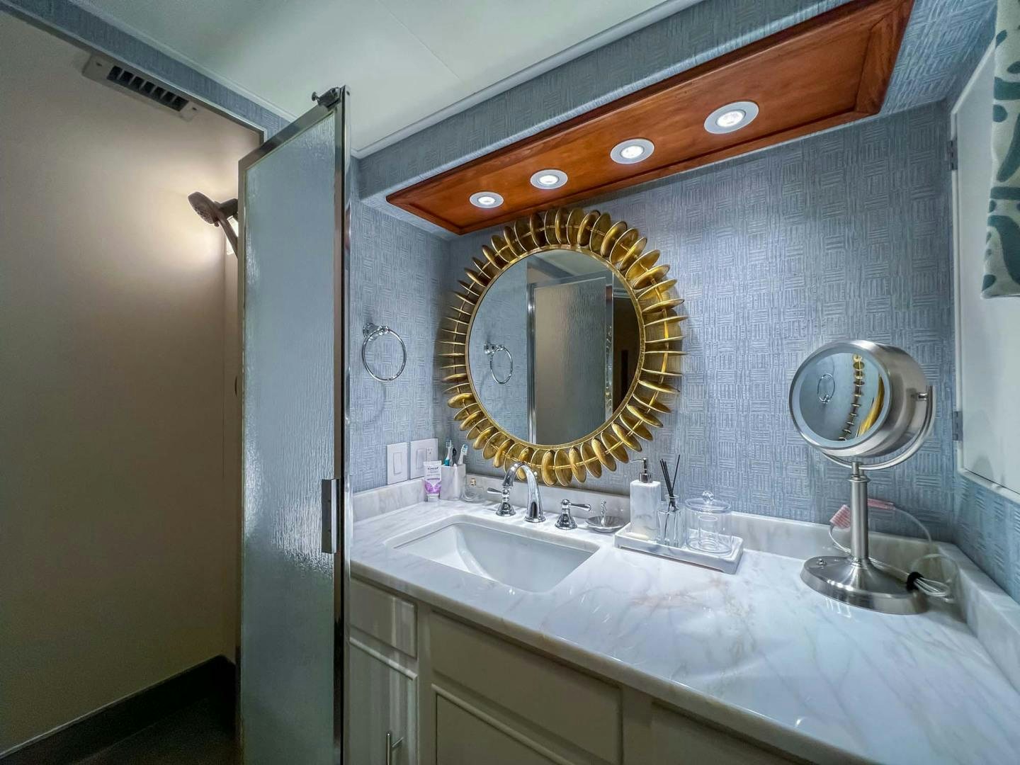 a bathroom with a large mirror aboard FREEDOM Yacht for Sale