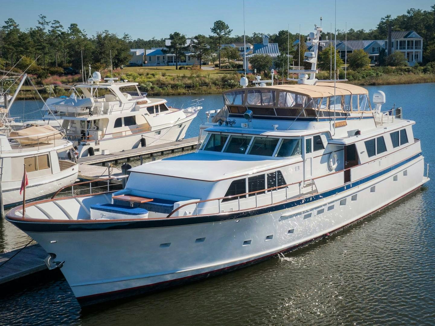 a group of boats are parked in a harbor aboard FREEDOM Yacht for Sale