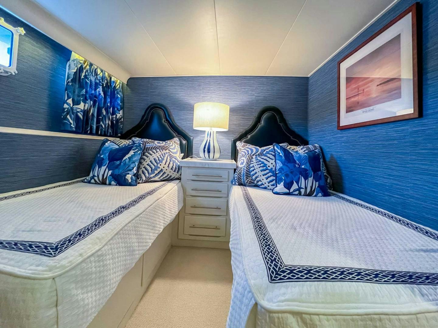 a couple of beds in a room aboard FREEDOM Yacht for Sale