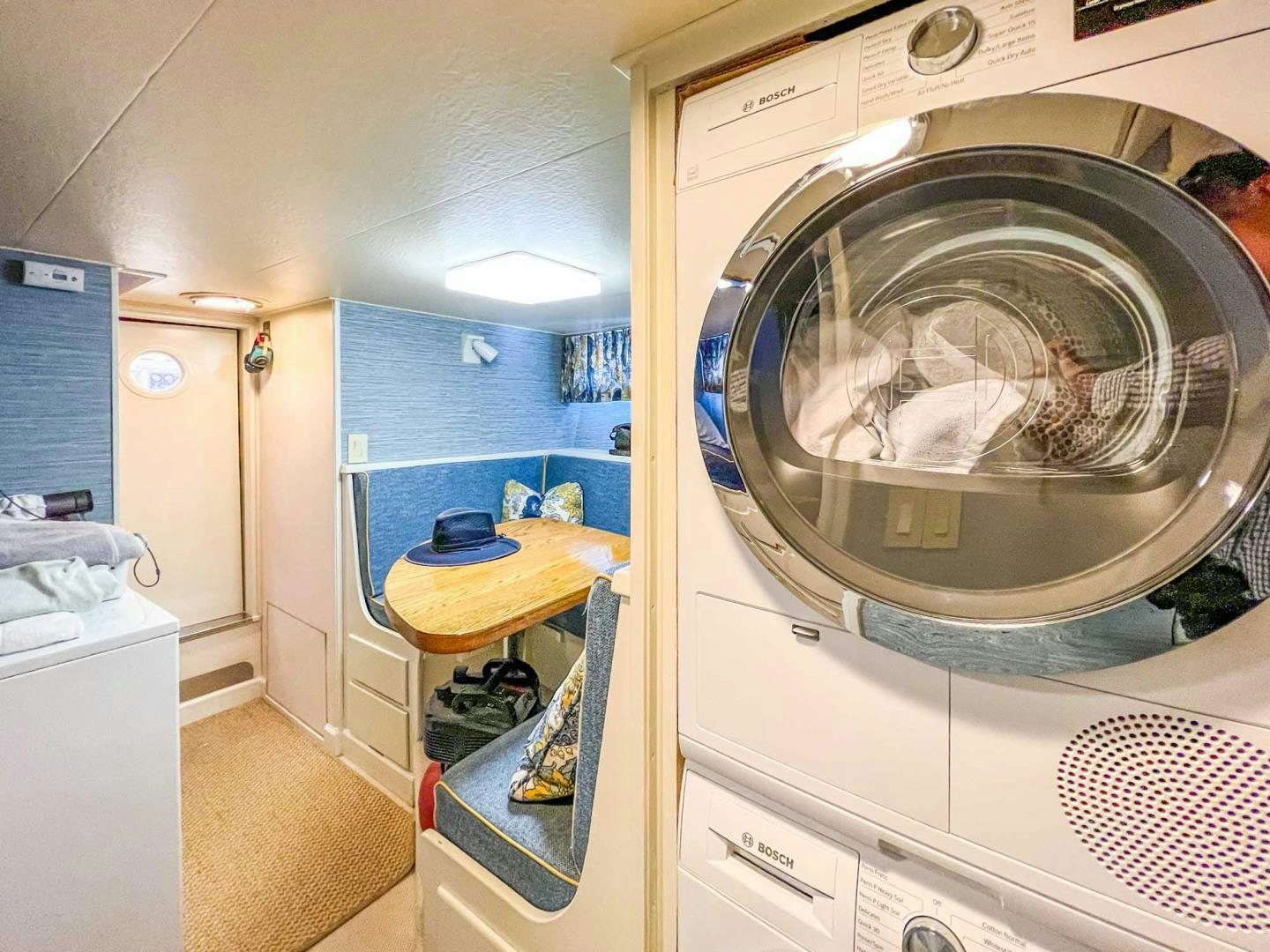 a laundry room with a washing machine aboard FREEDOM Yacht for Sale