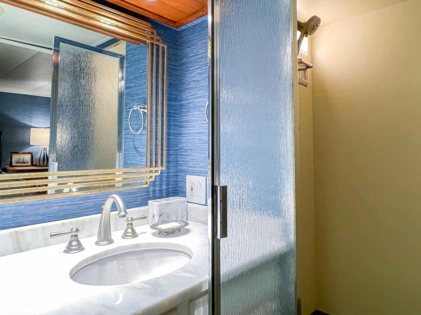 a bathroom with a mirror aboard FREEDOM Yacht for Sale
