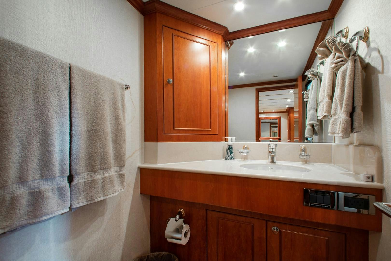 a bathroom with a sink and towels aboard BOXES II Yacht for Sale