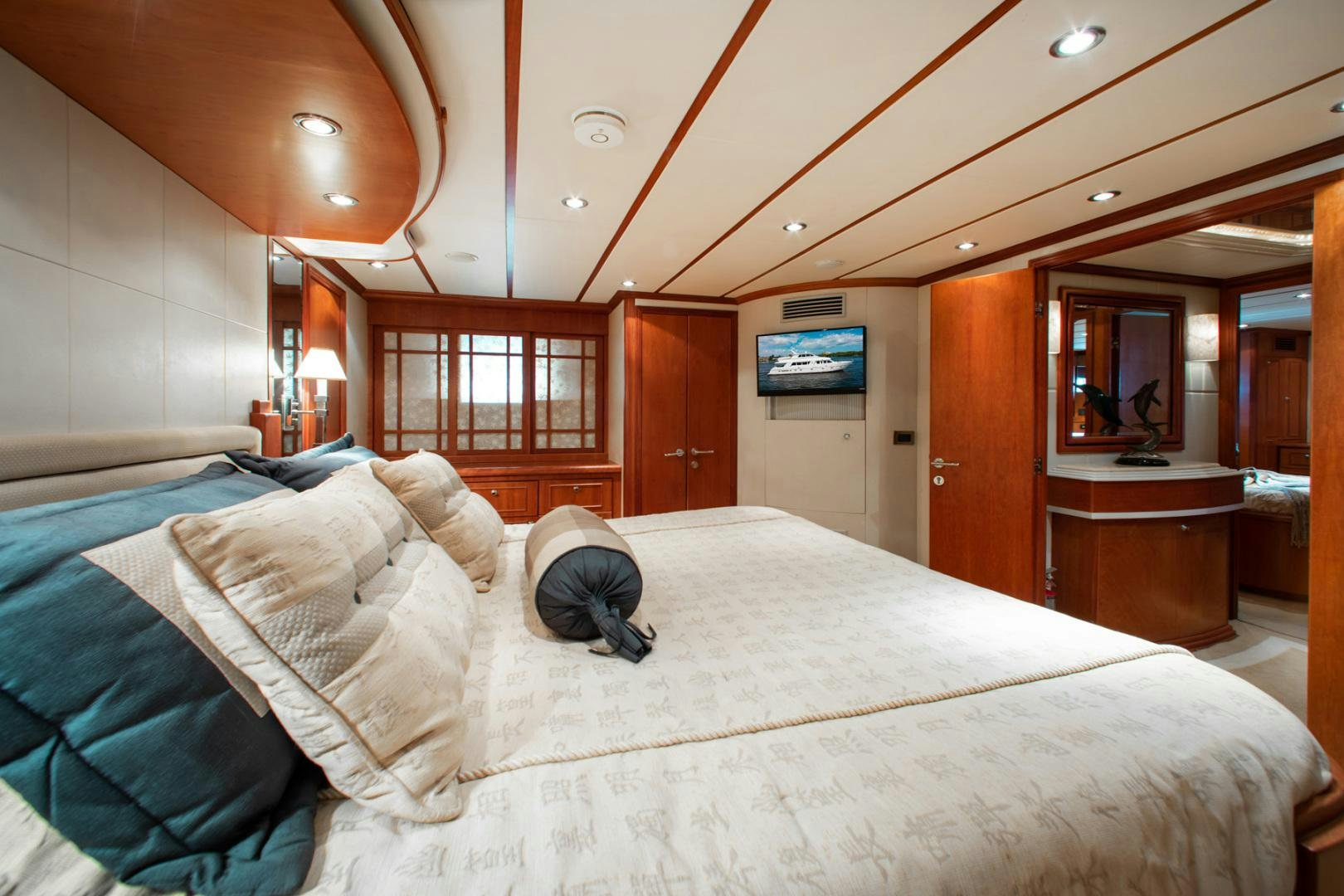 a person lying on a bed aboard BOXES II Yacht for Sale
