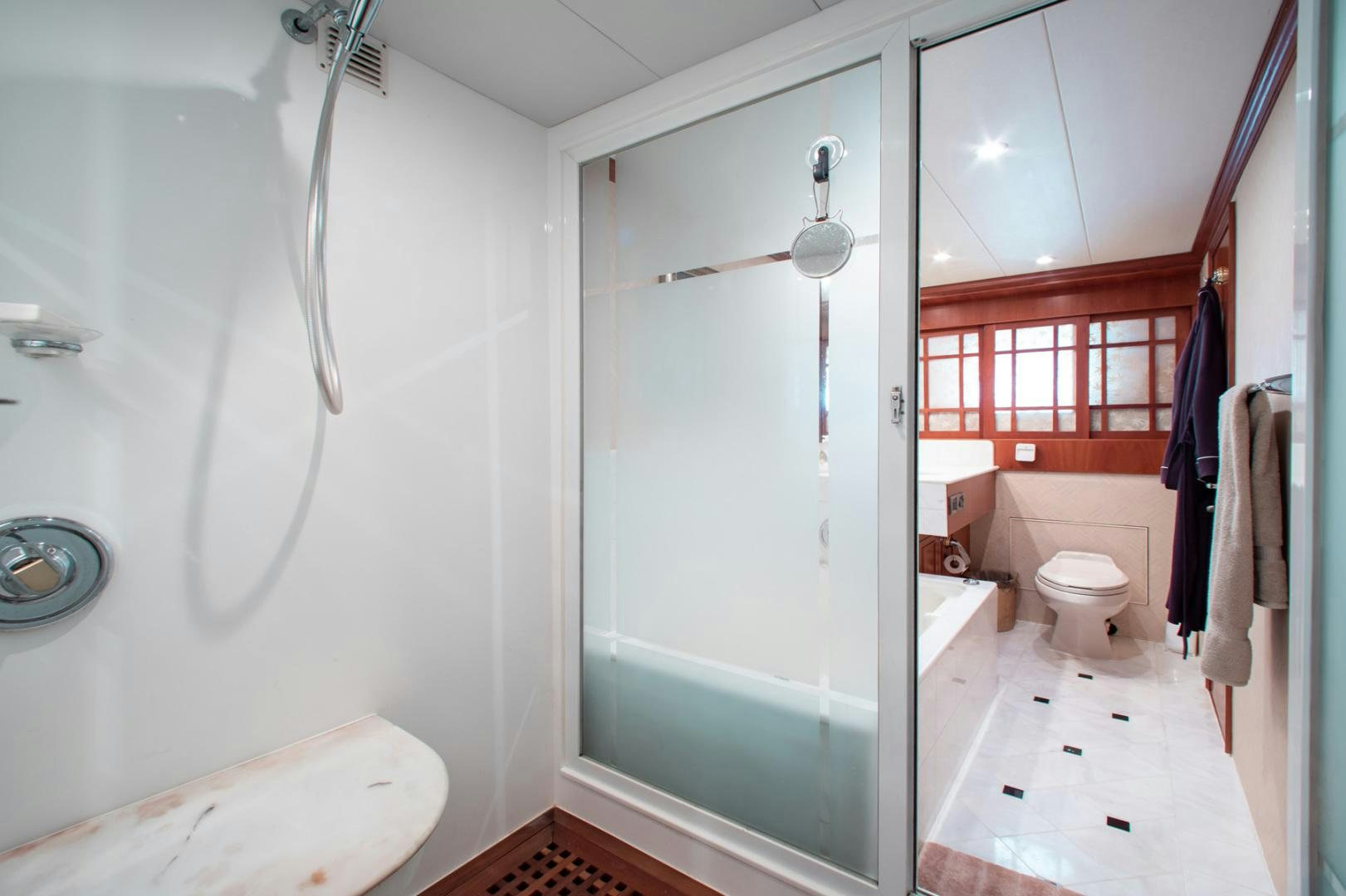 a bathroom with a shower and toilet aboard BOXES II Yacht for Sale
