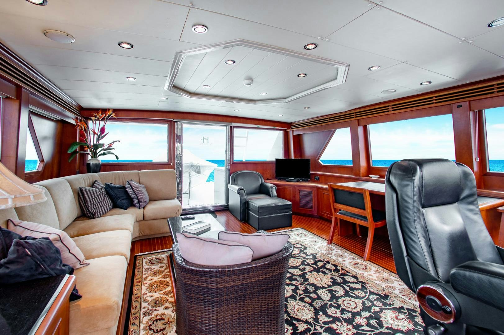 a living room with a couch and a table aboard BOXES II Yacht for Sale